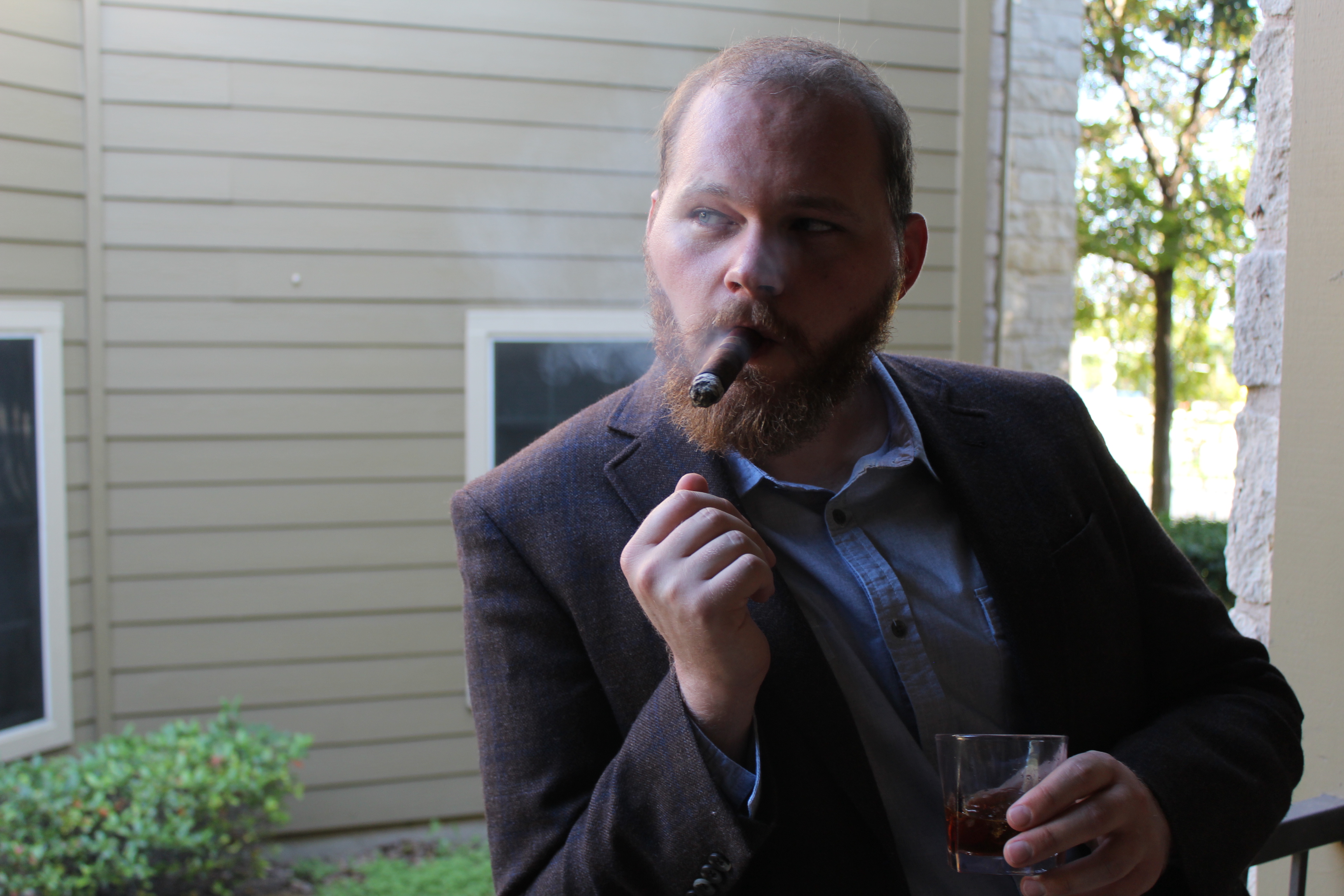 Keenan looking extremely cool, smoking a cigar.